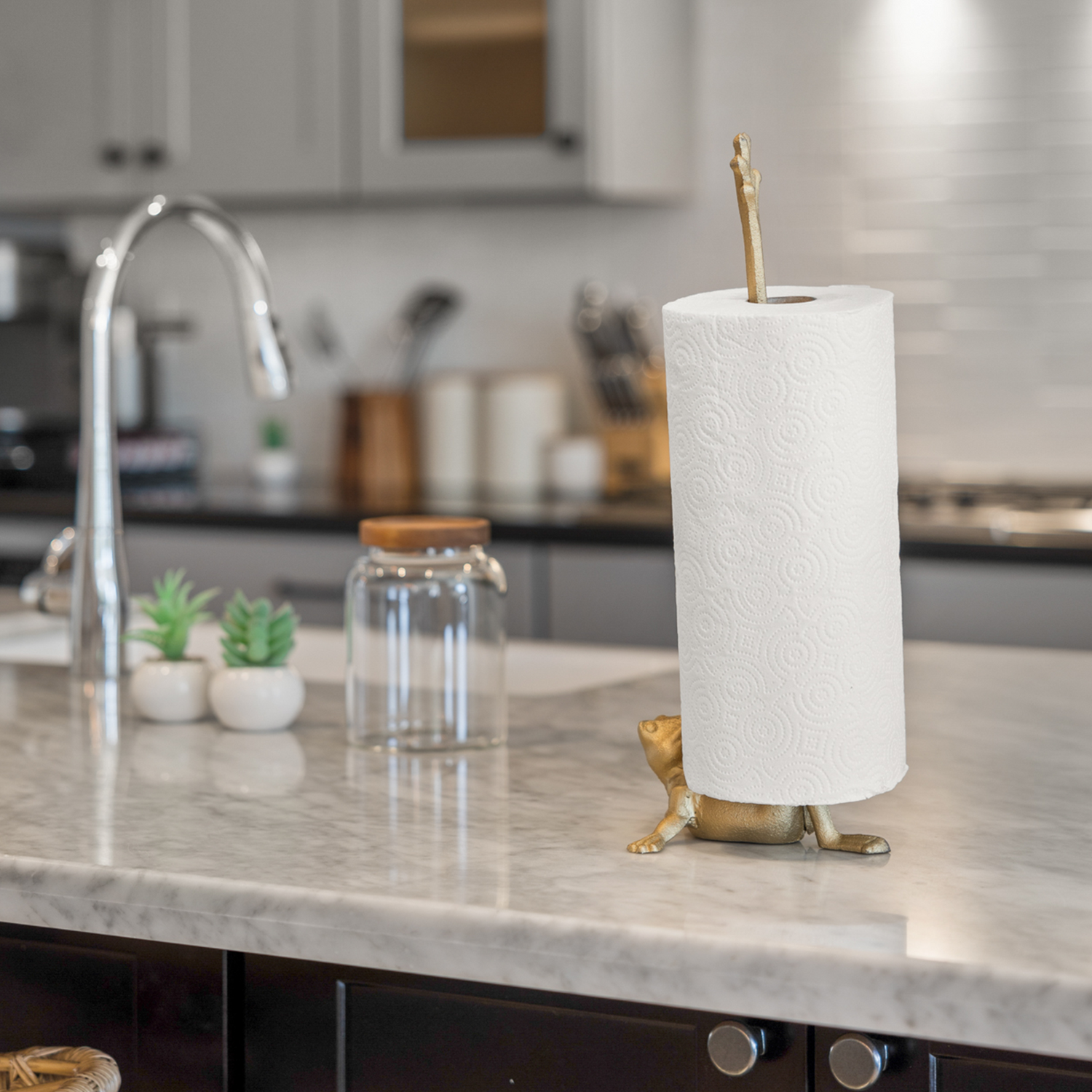 Wall Charmers gold cast iron frog paper towel holder, 14 inch freestanding, on a kitchen counter